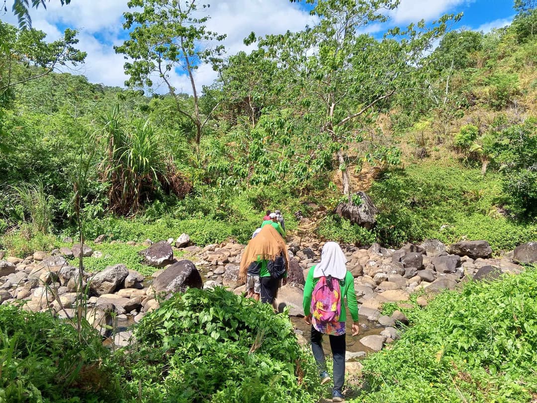 Community members surveying land